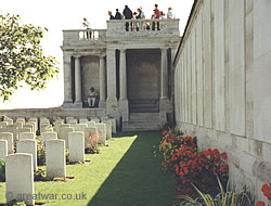 Visitors stand on the viewing platform looking across at the Loos battlefield.