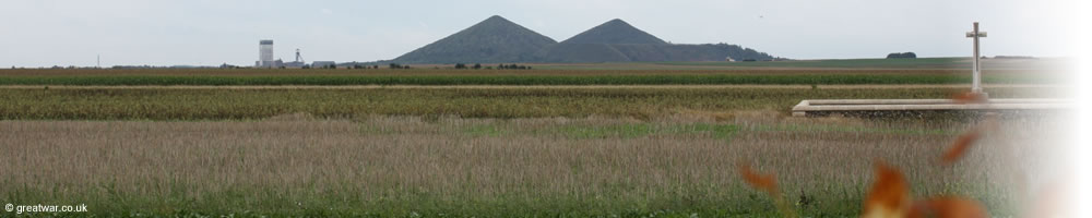 View looking due south from St. Mary's A.D.S. Cemetery of the Double Crassier slag heap, one of the landscape characteristics of the Loos battlefield in Artois. Ninth Avenue British Military Cemetery is in the foreground.