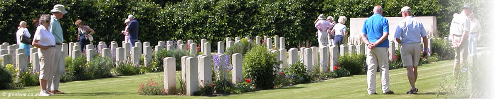 A tour group visit graves at Berks Cemetery Extension, Ploegsteert, Ypres Salient.