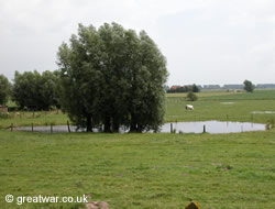 A farm pond created by a shell crater.